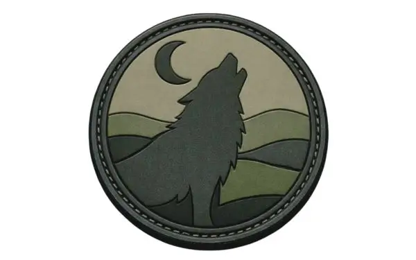 A 2D custom PVC patch featuring a howling wolf silhouette and crescent moon with clean, flat molded levels.