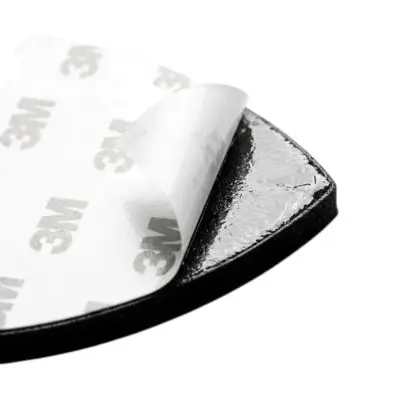 Close up of a patch with heat seal adhesive backing ready for iron-on application.