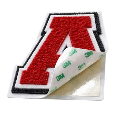Red chenille letter A patch with a 3M peel-and-stick adhesive backing revealed.