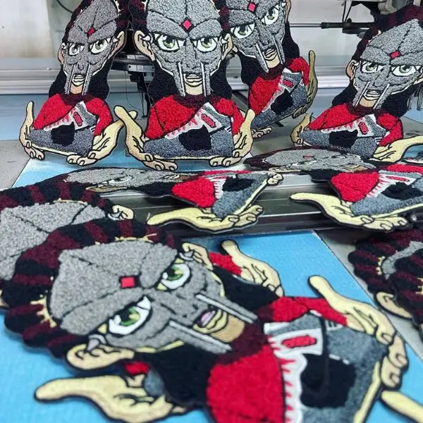 Bulk production run of custom character chenille patches showing high-volume manufacturing capability in Los Angeles.