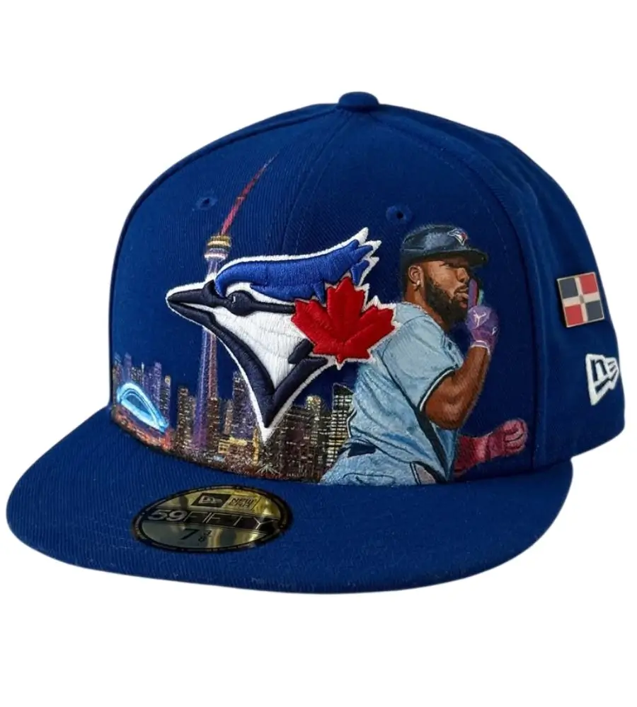 High-detail custom hat patch featuring a cityscape and baseball player design perfectly applied to a structured blue New Era hat.