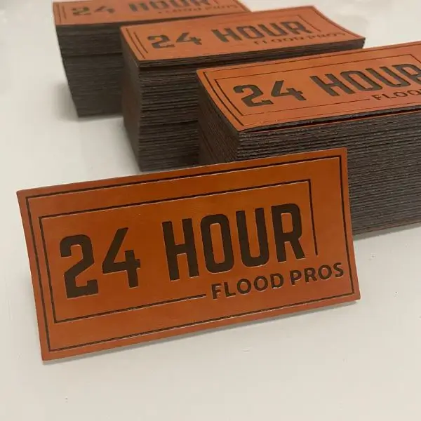 Large rectangular brown leather patches for 24 Hour Flood Pros with deep debossed text.
