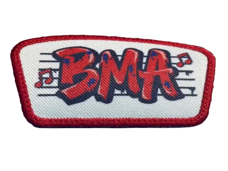 Custom dye-sublimated printed patch with vibrant red gradients and fine musical note detail.