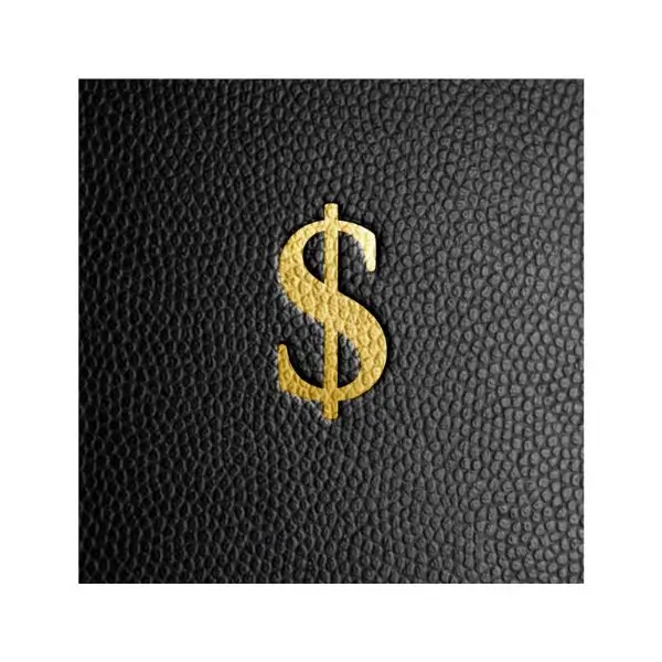 Metallic gold foil stamping on black pebbled leather showing a high-end fashion branding finish.