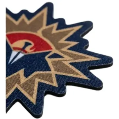 Extreme close-up of a laser-cut patch edge showing a clean, flat, cauterized seal without any raised stitching border.