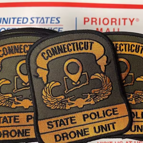 Custom olive green and gold embroidered patch for the Connecticut State Police Drone Unit.