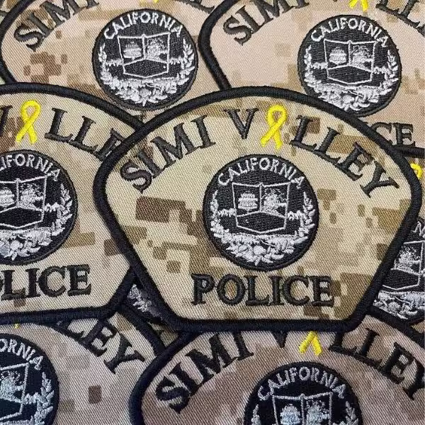 Simi Valley Police California embroidered patch on a desert digital camo background featuring a yellow ribbon and central seal.